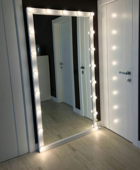 Large mirror with lamps