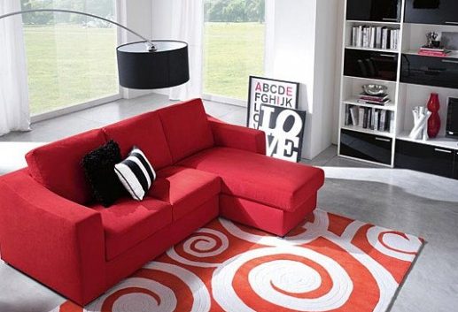 Red bright sofa in the gray room
