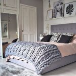Bed with a soft headboard with an unusual bedspread