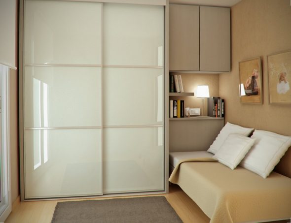 Wardrobe with plastic elements in the interior of a small bedroom