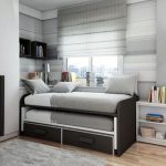 Modern stilig säng i inredningen av ett sovrum tonåring