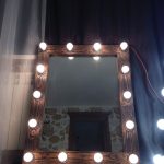 Wooden mirror with light