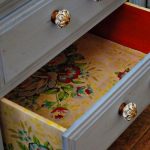 Decoupage inside chest of drawers