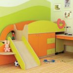 Children's furniture: a bed with a slide and a vykatny table