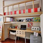 Suspended children's loft bed with a desk