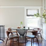 Glass round table and interesting shaped kitsch wooden chairs