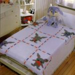 Pleteni prekrivači u dječjim krevetima
