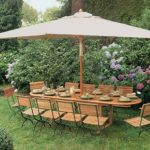 Wooden table with a canopy for the dacha