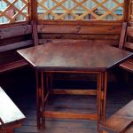 Wooden table in the gazebo with their own hands