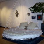 Children's round bed hanging on the ropes