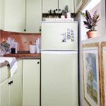 If the refrigerator is not built into the headset and does not fit into the interior of the kitchen, you can glue it and furniture fronts of the same tone
