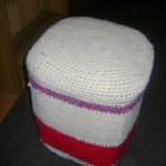 Padded stool from plastic bottles with a knitted cover