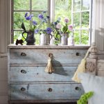 Aged chest of drawers in a country-style bedroom