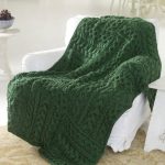 Green knitted plaid blanket