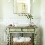 Green sink in Provence style bathroom