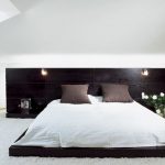 Bed-podium with lights in the headboard