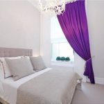 Small bedroom with purple curtain