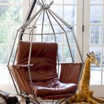 Unusual version of a leather suspended chair mounted on a stand