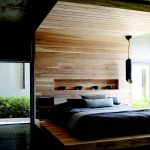 Stylish design bedroom with a bed-podium