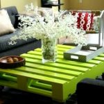 Green table from a pallet with his hands
