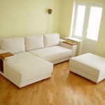 White transforming sofa with built-in shelves