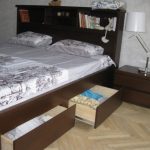 King size bed with integrated headboard and shelves downstairs