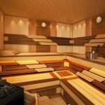 Wooden shelves and benches in the steam room of different wood