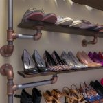 The shelf for footwear from pipes and the boards the hands