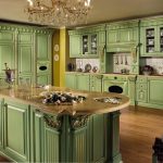 Green kitchen with an island