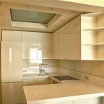 White kitchen with cupboards to the ceiling and a beautiful ceiling with lighting