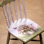 White-green chair after restoration with a beautiful pattern in the style of Provence