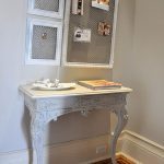 White console table with openwork elements