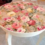 White round table decorated using decoupage technique