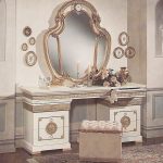 White table with a mirror with golden decor
