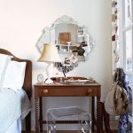 Wooden dressing table near the bed