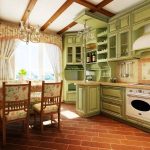 Bella cucina verde con soppalchi alti armadio
