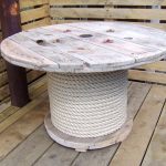 Unusual design of a round table with a leg wrapped with twine