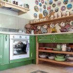 Open green kitchen without top cabinets