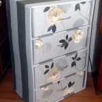 Simple cardboard chest of drawers, covered with wallpaper