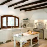 Spacious kitchen with beams without wall cabinets