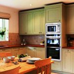Tall kitchen cabinets in green
