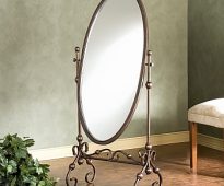 Oval mirror on stand