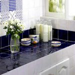 Combining white and blue tiles on the kitchen counter top and apron