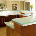 The glass worktop in the kitchen is stylish and beautiful.