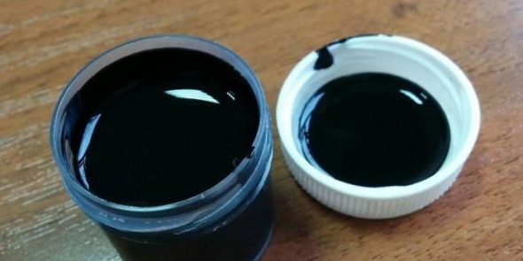 Black liquid skin in a jar