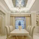 Classic bright dining room with a mirrored ceiling