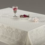 Snow-white festive tablecloth on the dining table