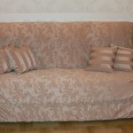 Beige euro-cover on a small sofa