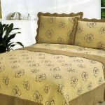 Decorative cover and pillows with floral pattern