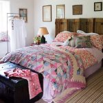 Double sided bedspread on the bed in the style of patchwork